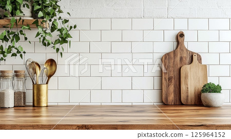 Kitchen brass utensils, chef accessories. Hanging kitchen with white tiles wall and wood tabletop.Green plant on kitchen background generated ai  125964152