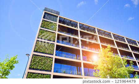 Modern city eco office building with tree. Detail shot of modern architecture facade,business concepts. Environment. Modern building and trees, double exposure. 125964479