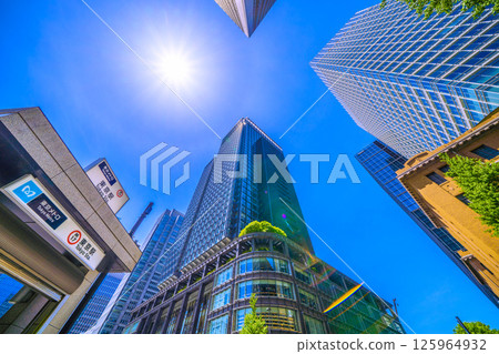 Tokyo cityscape in Japan. View of Tokyo Station (exit M10) on the Tokyo Metro Marunouchi Line, Haro, and the Marunouchi buildings. 125964932