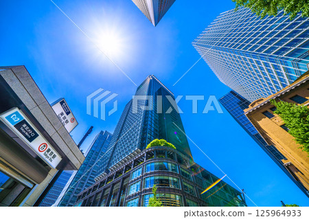 Tokyo cityscape in Japan. View of Tokyo Station (exit M10) on the Tokyo Metro Marunouchi Line, Haro, and the Marunouchi buildings. Tokyo cityscape in Japan. View of Tokyo Station (exit M10) on the Tokyo Metro Marunouchi Line, Haro, and the Marunouchi buildings. 125964933