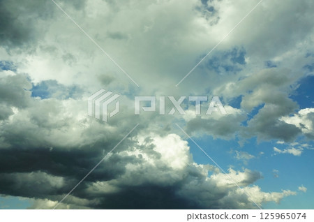 A beautiful landscape with a contrast between the blue sky and clouds A beautiful landscape with a contrast between the blue sky and clouds 125965074