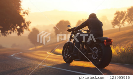 side view of black glossy motorcycle moving along asphalt road early morning. rider, dressed dark jeans and boots, is dynamic pose as sun rises 125965916
