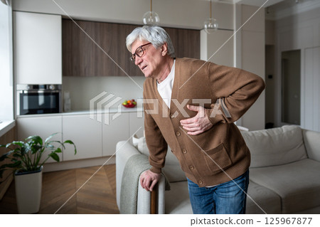 Hard breathing exhausted old man suffer acute chest pain, coronary artery blockage, myocardial issue 125967877