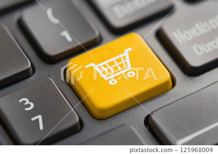 Online shopping cart button on keyboard, symbolizing e commerce growth Online shopping cart button on keyboard, symbolizing e commerce growth 125968009