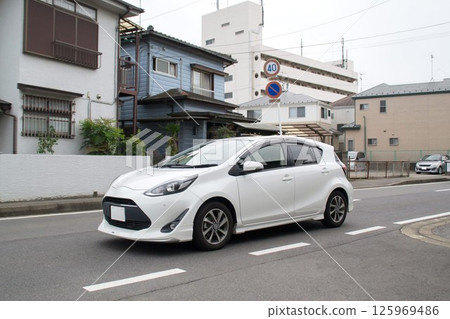 Compact car - Road driving 125969486