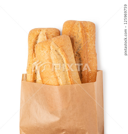 Two baguettes coming out of paper bag isolated on white background Two baguettes coming out of paper bag isolated on white background 125969759