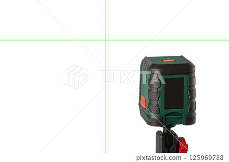 Green laser level tool projecting horizontal and vertical lines 125969788