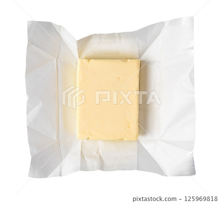Wrapped butter block on white background: dairy product photography 125969818