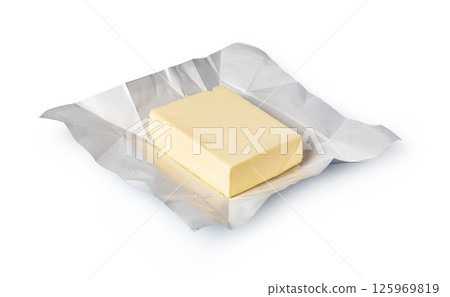 Wrapped butter block on white background: dairy product photography 125969819