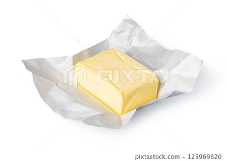 Wrapped butter block on white background: dairy product photography 125969820
