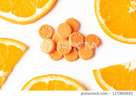 Orange effervescent tablets vitamins C on white background 125969893