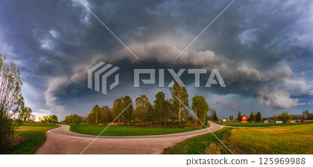 Supercell, shelf, arcus storm clouds over the fields in summer 125969988