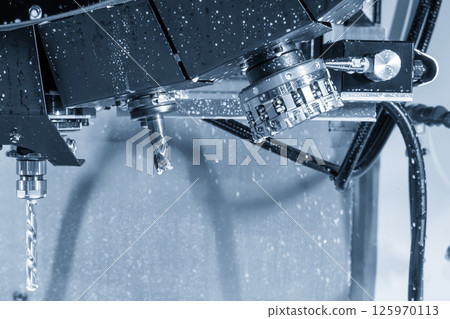 Close up scene the CNC milling tool magazine with the face mill and drill tool in the light blue scene. 125970113