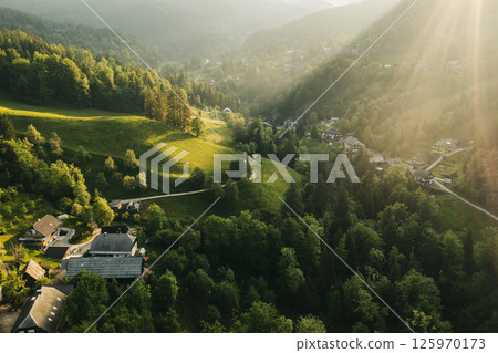 Calm idyllic village in Slovenian mountains at sunrise, summer travel concept 125970173