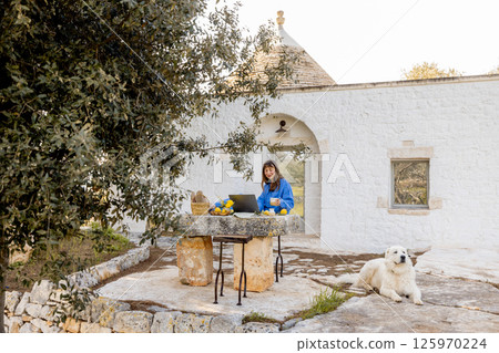 Remote work outside trullo house Remote work outside trullo house 125970224