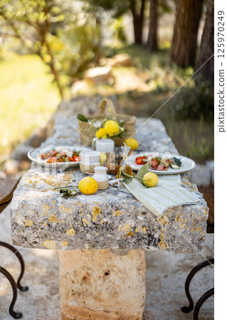 Rustic Lunch on a Stone Table Rustic Lunch on a Stone Table 125970249