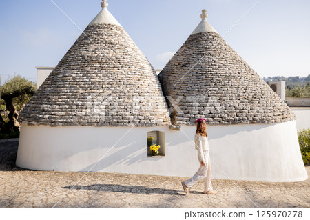 Walk by the trullo 125970278