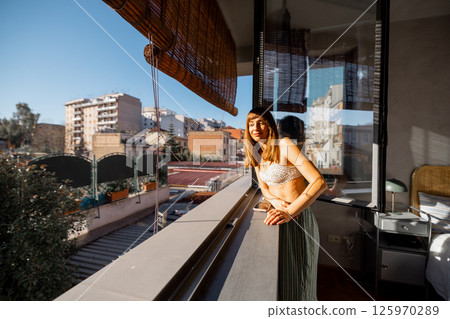 Sunlit Pause on a Roman Balcony 125970289