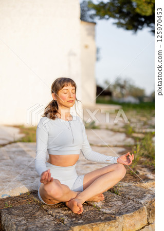 Balance and Strength at Sunrise 125970453