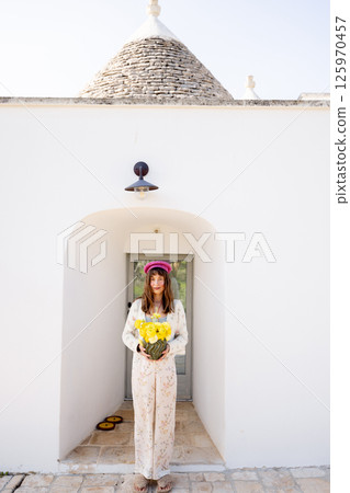 Trullo entrance with flowers Trullo entrance with flowers 125970457
