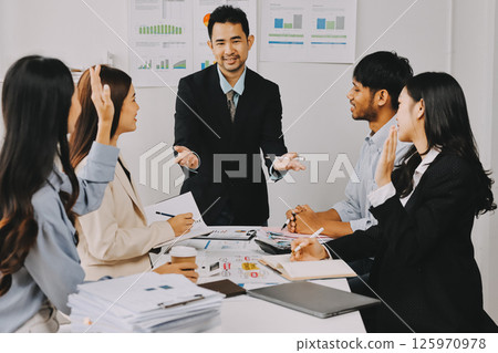 Team of financial advisory services. Asian advisor showing plan of investment to clients in the consultancy office. Team of financial advisory services. Asian advisor showing plan of investment to clients in the consultancy office. 125970978