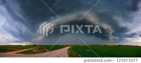Supercell, shelf, arcus storm clouds over the fields in summer Supercell, shelf, arcus storm clouds over the fields in summer 125971077