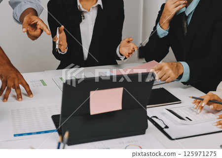 Team of financial advisory services. Asian advisor showing plan of investment to clients in the consultancy office. Team of financial advisory services. Asian advisor showing plan of investment to clients in the consultancy office. 125971275
