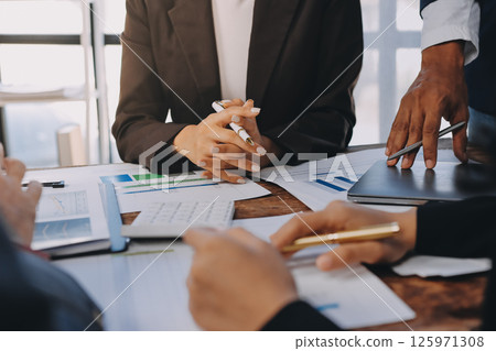 Business financing accounting banking concept. Business woman hand doing finances and calculate on desk about cost at home office. Woman working on desk with using calculator, finance accounting. 125971308