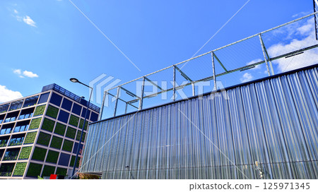 Architecture details of modern metal sheet facade storage building minimal style. Architecture details of modern metal sheet facade storage building minimal style. 125971345