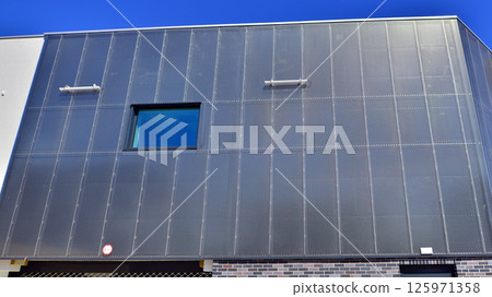 Architecture details of modern metal sheet facade storage building minimal style. Architecture details of modern metal sheet facade storage building minimal style. 125971358