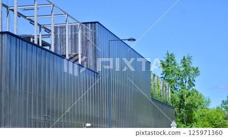 Architecture details of modern metal sheet facade storage building minimal style. Architecture details of modern metal sheet facade storage building minimal style. 125971360
