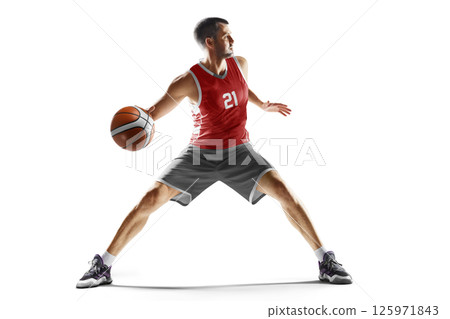 Male basketball athlete dribbling the ball. Professional basketball player in motion and action. Basketball. Sport emotion. In white 125971843