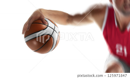 Basketball player in motion and action. Male basketball athlete dribbling the ball. Basketball close-up. Focus on the ball. Isolated 125971847