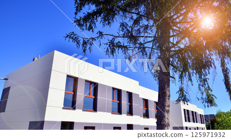 New single family houses in a new development area. Residential homes with modern facade.  125971932