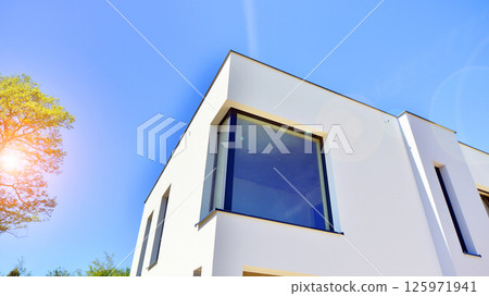 New single family houses in a new development area. Residential homes with modern facade. New single family houses in a new development area. Residential homes with modern facade. 125971941