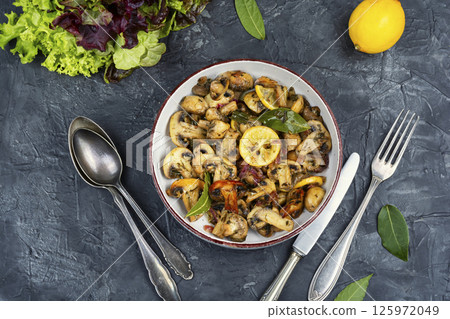 Fried mushrooms with lemon garlic sauce. 125972049