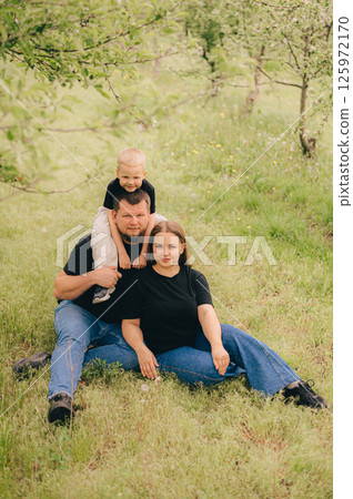 Family Portrait in Outdoor Setting with Smiling Faces Family Portrait in Outdoor Setting with Smiling Faces 125972170