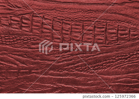 Crocodile genuine leather texture macro, red leatherette with metallic, pearlescent effect 125972366