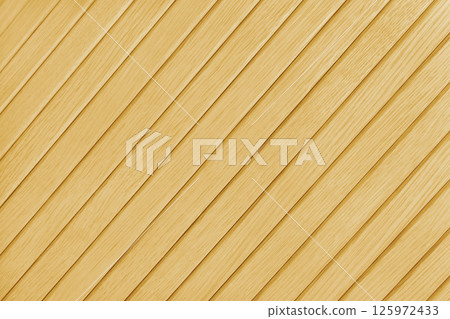 Wooden diagonal plank, bamboo surface texture, yellow colored board, wall background 125972433