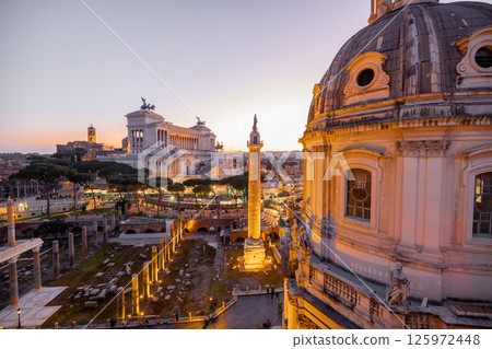 Sunset over Roman rooftops and ruins 125972448