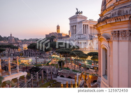 Sunset over Roman rooftops and ruins Sunset over Roman rooftops and ruins 125972450