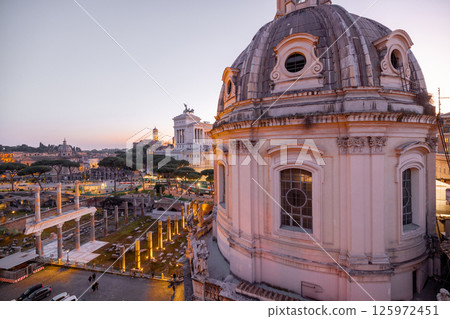 Sunset over Roman rooftops and ruins 125972451