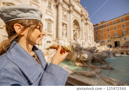 Smiling with a Cannolo by Trevi Fountain 125972568