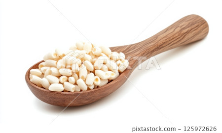Puffed grains in a wooden spoon showcasing the texture and detail of an organic snack option 125972626