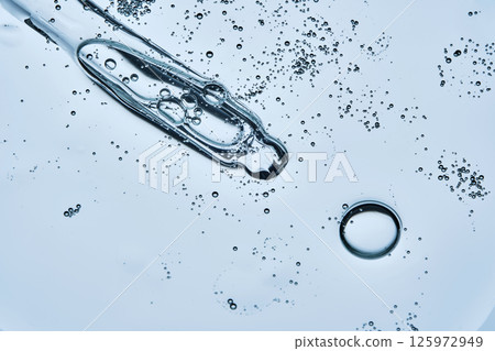 The texture of a serum or cosmetic gel with a dropper. The texture of a serum or cosmetic gel with a dropper. 125972949
