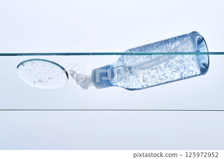 Micellar gel for cleansing the skin from makeup on a glass shelf. Micellar gel for cleansing the skin from makeup on a glass shelf. 125972952