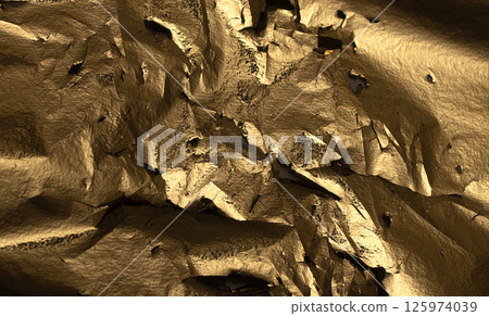 Golden metallic foil texture with crumpled, torn, and rugged edges. Shiny, reflective surface with 125974039