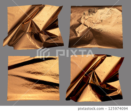 Crumpled copper and gold foil with a metallic, reflective texture creates an abstract, luxurious 125974094
