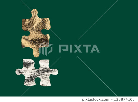 Gold and silver foil puzzle pieces with metallic texture create a visual contrast, symbolizing the 125974103