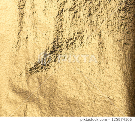Gold foil background with a vintage, worn texture. Polished, sleek metal pattern, rich in detail and Gold foil background with a vintage, worn texture. Polished, sleek metal pattern, rich in detail and 125974106
